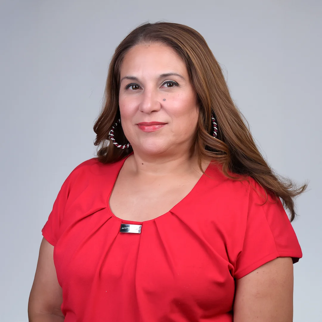 Woman in red shirt posing