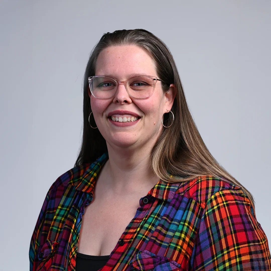 Person in colorful plaid shirt.