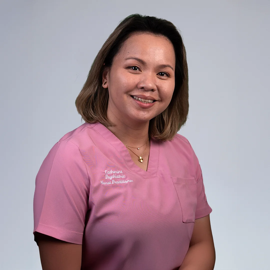 Person in pink medical scrubs.