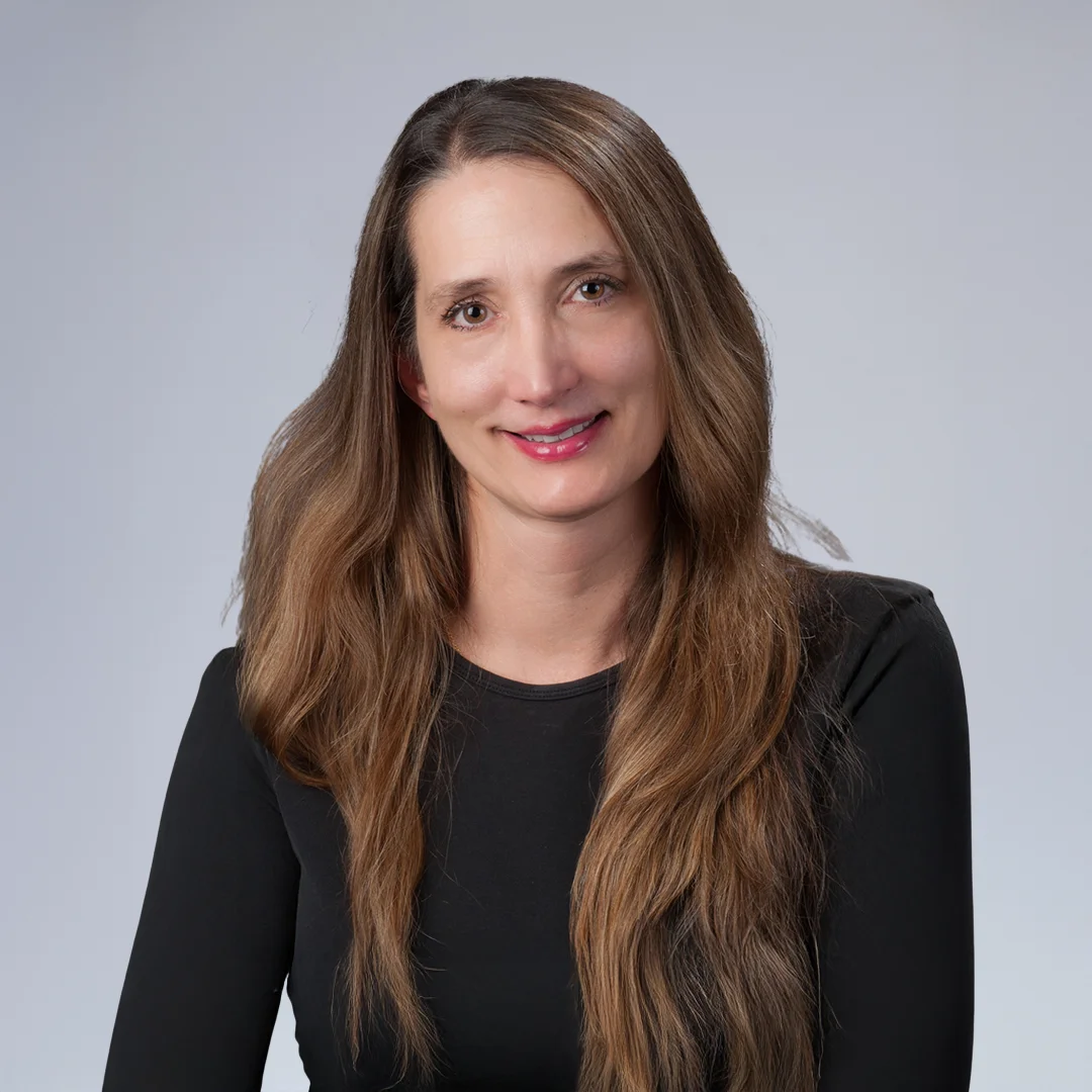 Woman with long, wavy hair.