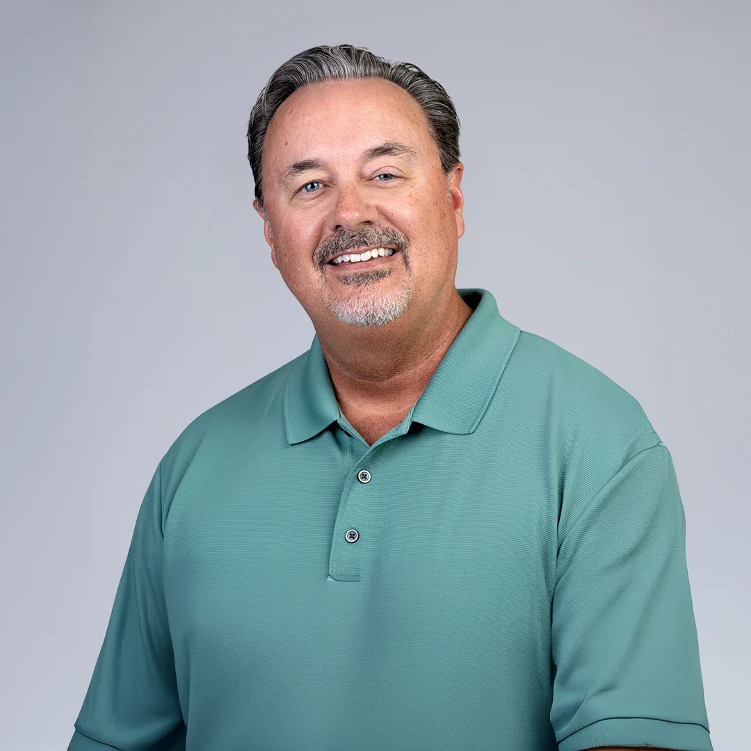 Man in green polo shirt.