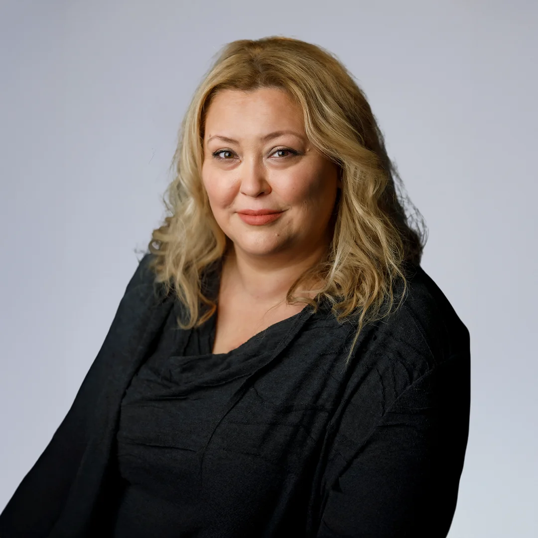 Woman with blonde hair in black