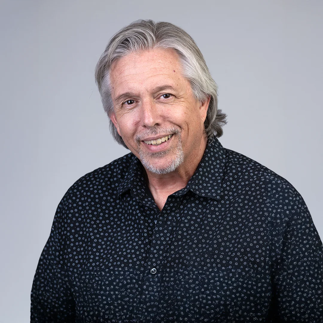 Man in patterned black shirt