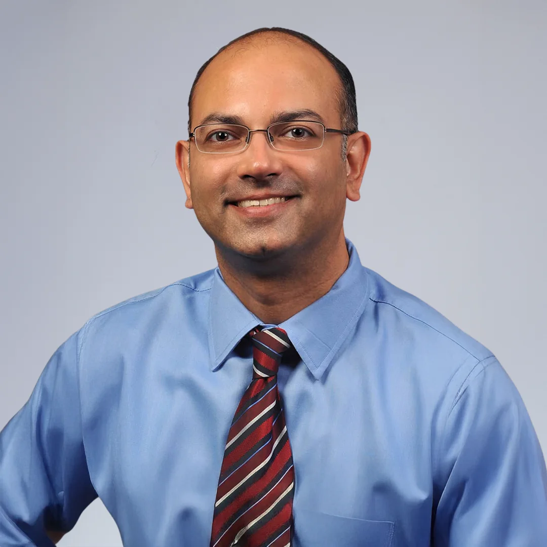 Man in blue shirt and tie