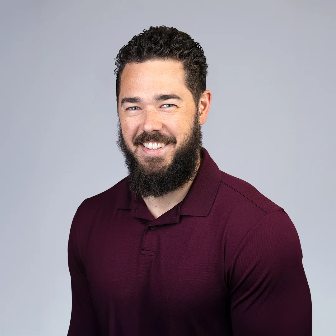 Man in maroon polo shirt