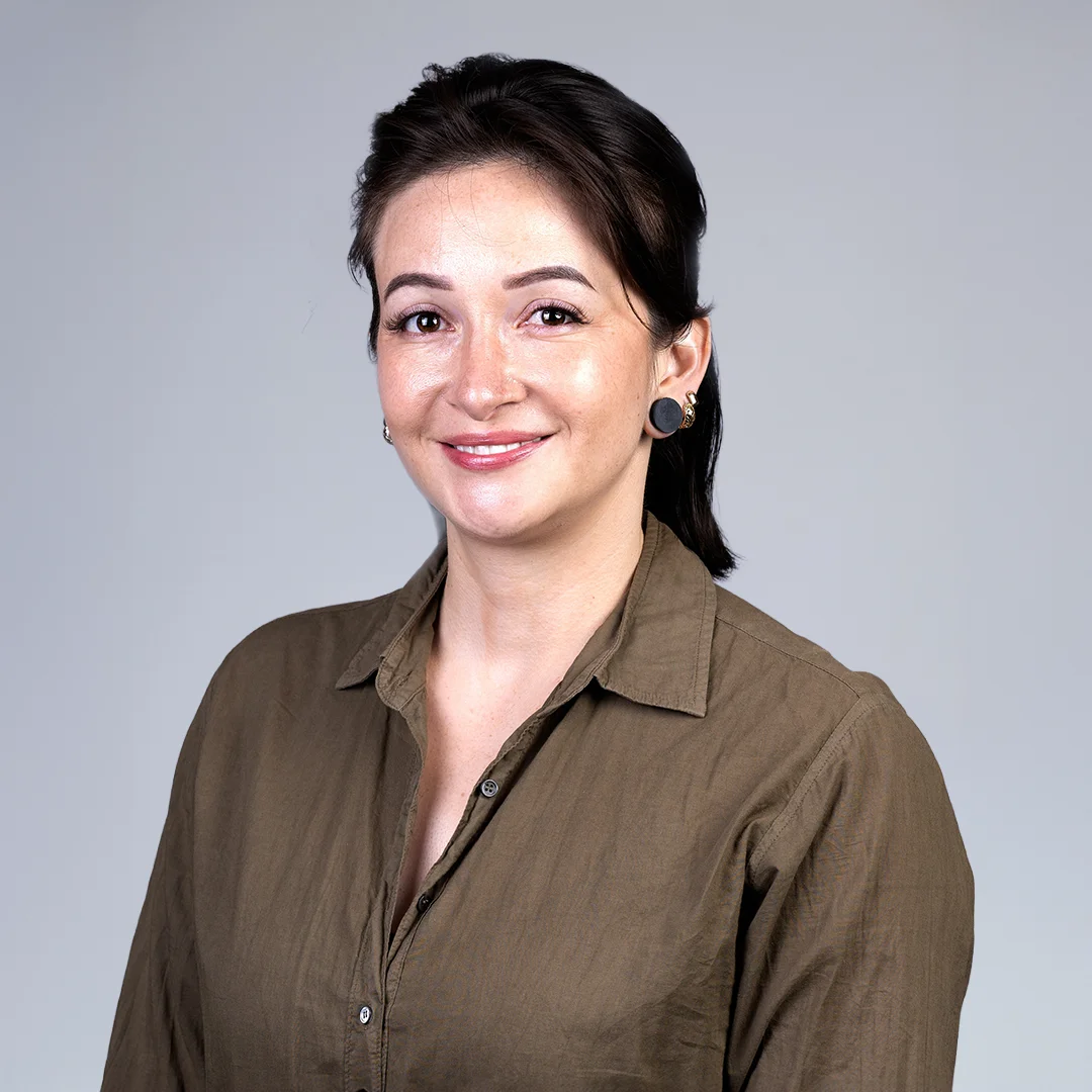 Smiling woman in brown shirt